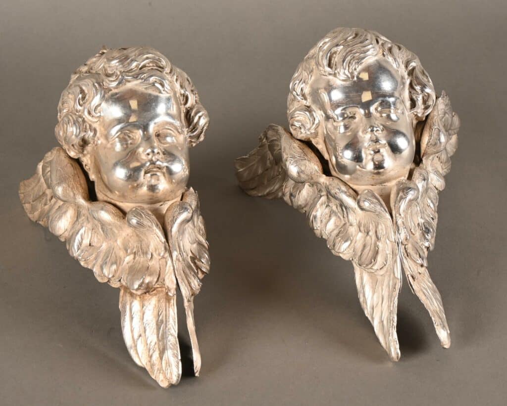 Deux têtes d'anges en argent