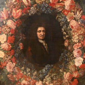 Portrait d'un homme en oval entouré d'une couronne de fleurs